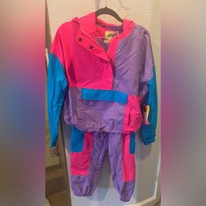 Two-piece jacket and pants set. Brand new with tags. Never been worn. Multicolor